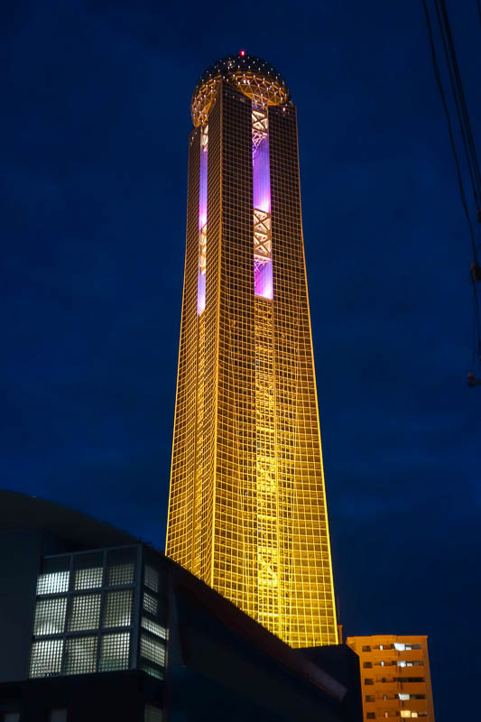 Japan 2015 - Tokyo - Nagoya - Hiroshima - Shimonoseki - Fukuoka - Giant phallus changes colors at night. I couldnt find anything of interest around the bottom of it. By all accounts the restaurant at the top is terri