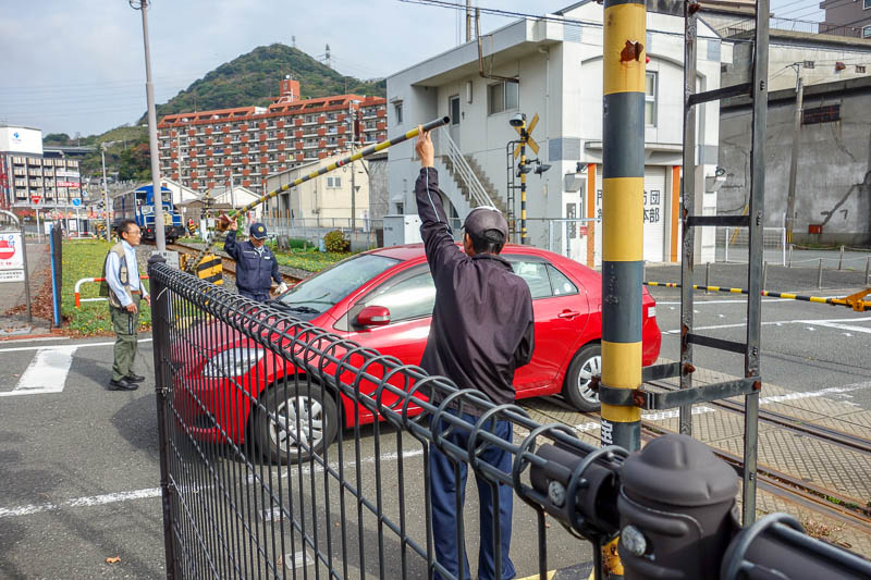 Japan 2015 - Tokyo - Nagoya - Hiroshima - Shimonoseki - Fukuoka - Now for todays hilarity. This woman ignored the flashing lights for the rail crossing, and got stuck between the gates. You can see the train in the b