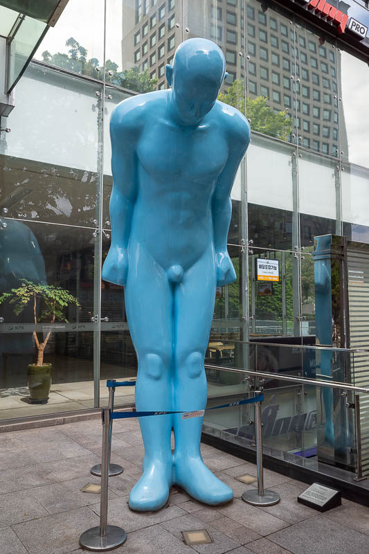 Korea-Seoul-Hongdae - Blue man with penis statue is very popular in many parts of Seoul. The plaque refers to him as greeting man. I am not sure if you are supposed to touc