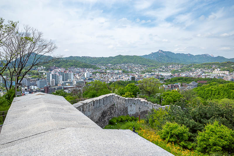 Korea-Seoul-Hyehwa-Naksan - Underground railway to a wall on a hill