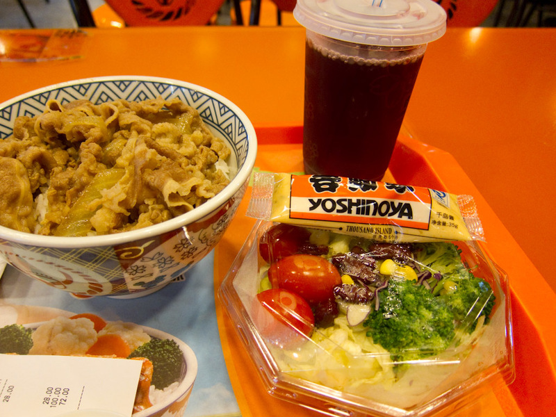 China-Beijing-Xidan-Shopping Street-Neon - My dinner at Yoshinoya. Some plain tasting beef on top of a mass of rice. I ate the beef then mixed the salad with the rice. Also, purple drink. Even 