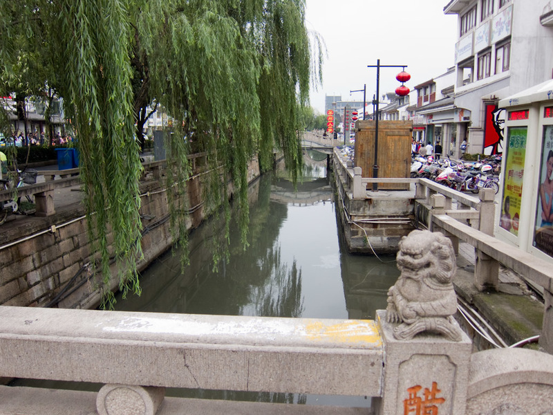 China-Suzhou-Garden-Pagoda - One of many canals. They call this place the Venice of the east, really its the open sewer world of the east caust it smells. But I have heard the sam