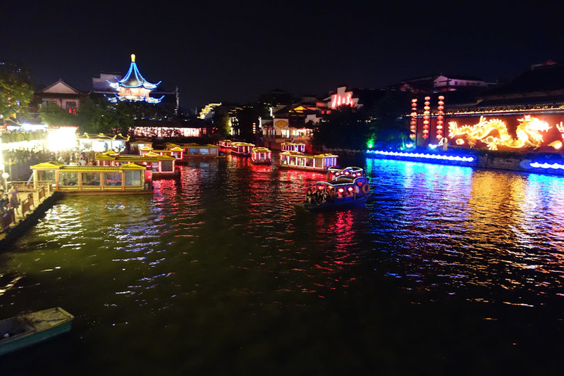 China-Nanjing-Mall-Canal - There is also more canals going around the area, with neon coated boats seemingly racing each other along them under all the old low bridges. The line