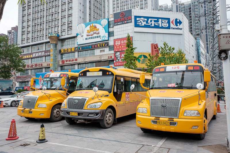 The great loop of China - April 2018 - 3 electric long nose school buses. So much of everything is electric, you have to be really careful crossing roads and footpaths because you cant hear