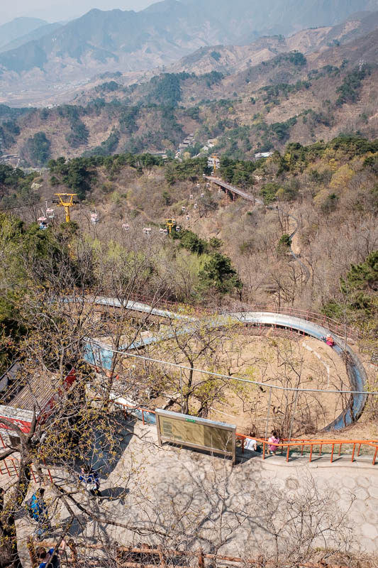 China-Great Wall-Mutianyu - Here is the luge track. Lots of people take the chair lift up, walk a hundred metres, take the luge track down.