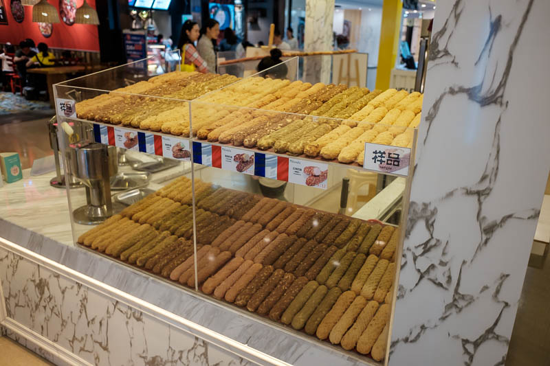 The great loop of China - April 2018 - This chain store selling these mini sweet baugettes are everywhere around Chongqing. They have the French flag prominently shown, but I doubt the fren