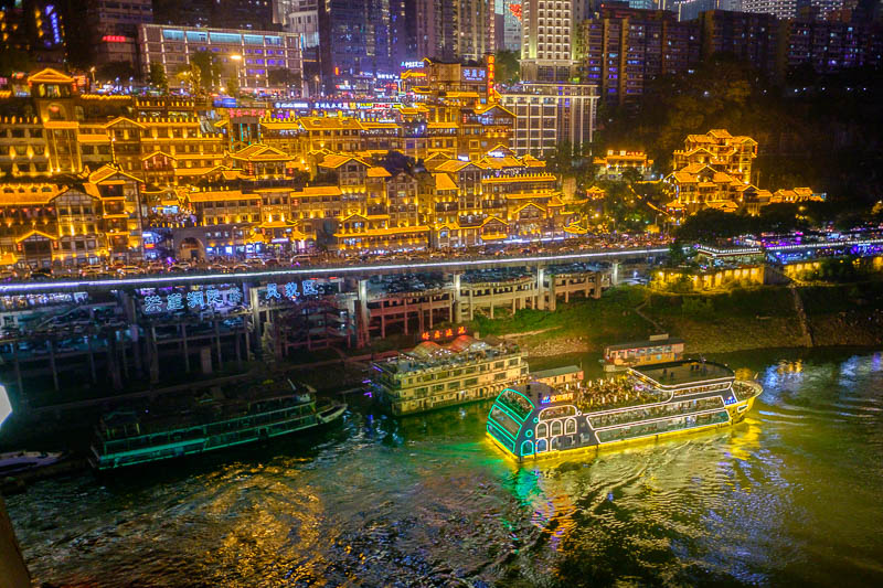 China-Chongqing-View-Hongyadong - Heres a lit up boat. And the cave tourist cliff area in the background.