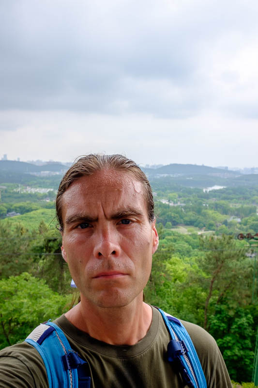The great loop of China - April 2018 - Look how hot I am! In every sense of the word. My shirt was dripping wet. My sweat is oily, probably red oil from Chongqing.