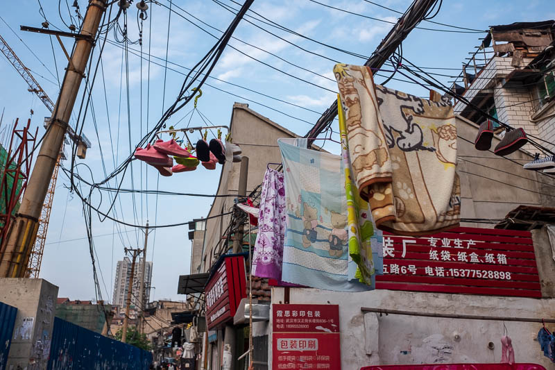 China-Wuhan-Recycling-Curry-Food - Bundles of mystery wires is as good a place as any to dry your clothes on.