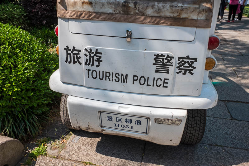 China-Hangzhou-West Lake-Hiking - Law & Order: Tourism Police. Theres a special police force for everything. There job, to scream at people who dare to walk on the grass. Really, that 