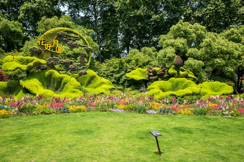 The great loop of China - April 2018 - Scene #10 - The neoness of being. Here we have an amazing neon cornucopia of flowers and sprayed on greenery to form a nondescript shape of awesomenes