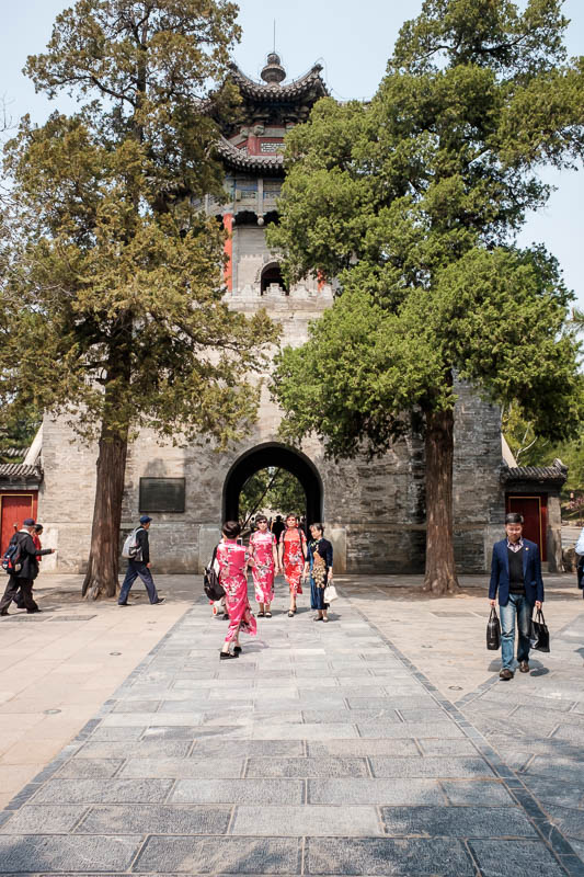 China-Beijing-Summer Palace - Now we leave the lake and head into palace world, here is a gate and some ladies who have dressed up for the occasion.