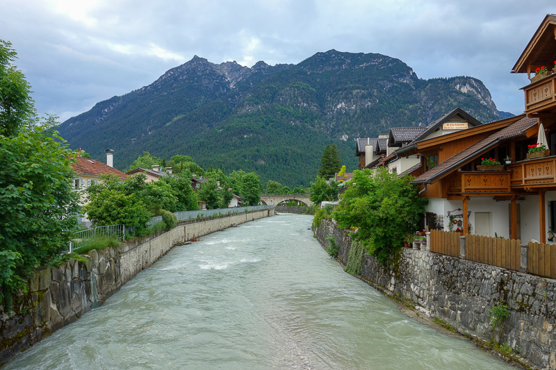 Germany-Garmisch Partenkirchen-Schnitzel - Nice photo of river running through town with mountain backdrop.