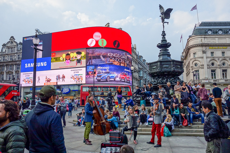 England-London-China Town-Picadilly Circus - And a gypsy band distracting people whilst their children pickpocketed the tourists.