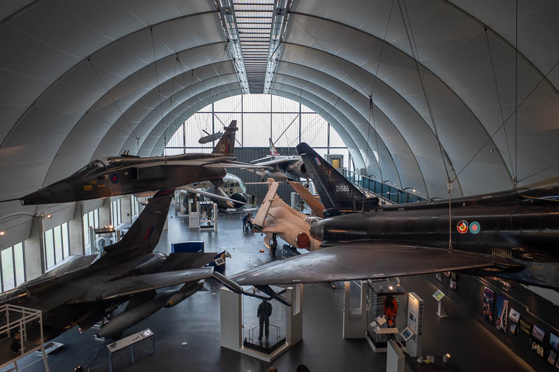 England-London-RAF Museum - The modern fighter hall. I took a photo of this same hall in this exact spot 10 years ago. The chains holding the jets up have not snapped yet.