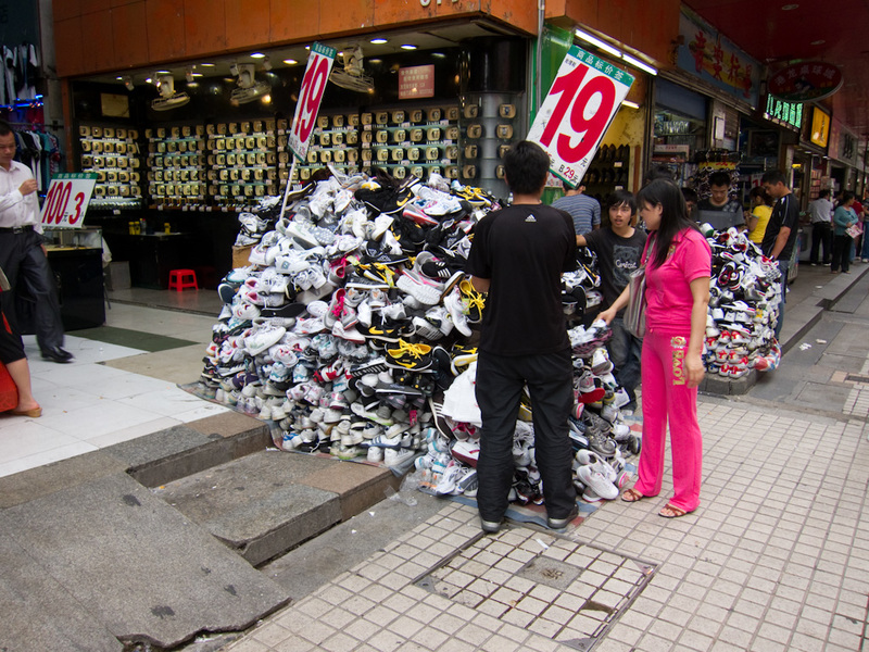 China-Shenzhen-Architecture - In the Dongman district, theres piles of anything you could want to buy, shoes like in this photo, but also clothes, handbags, socks, umbrellas, kids 