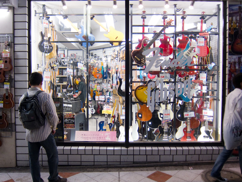 Japan-Tokyo-Shibuya-Guitar - The first of the multi storey guitar stores. Disappointingly the window has decals for fender and gibson, the worlds 2 crappiest guitar companies spec