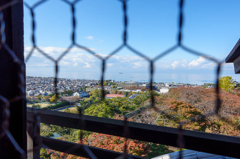 Japan-Hikone-Castle - But other than that one window spot, every other window is covered in chicken wire, to keep out enemy chickens. That is lake Biwa.