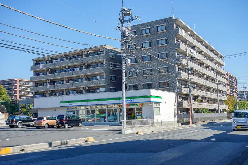 Japan 2015 - Tokyo - Nagoya - Hiroshima - Shimonoseki - Fukuoka - This is how most people in Tokyo probably live. No parks anywhere, mid rise apartment, and a family mart on every other corner. Lots of parking spots 