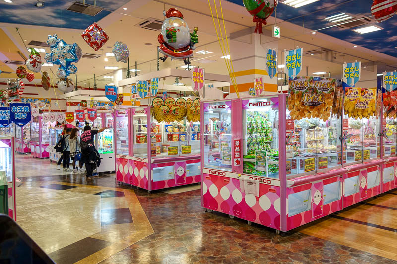Japan-Nagoya-Rain-Mall-Food - Row after row of claw skill testing machines.