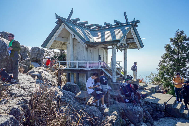 Japan 2015 - Tokyo - Nagoya - Hiroshima - Shimonoseki - Fukuoka - At the top, theres this thing with a bell. I guess its a shrine. There are no public toilets on the peak itself....