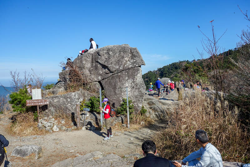 Japan-Fukuoka-Hiking-Mount Homan-Dazaifu - There are lots of people hanging around having a picnic.