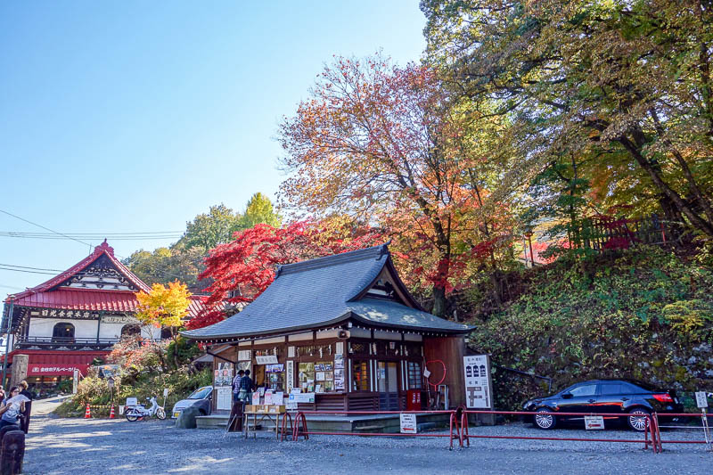 Japan-Nikko-Autumn-Bridge - This is the ticket booth for the bridge walk. Nice leaves.