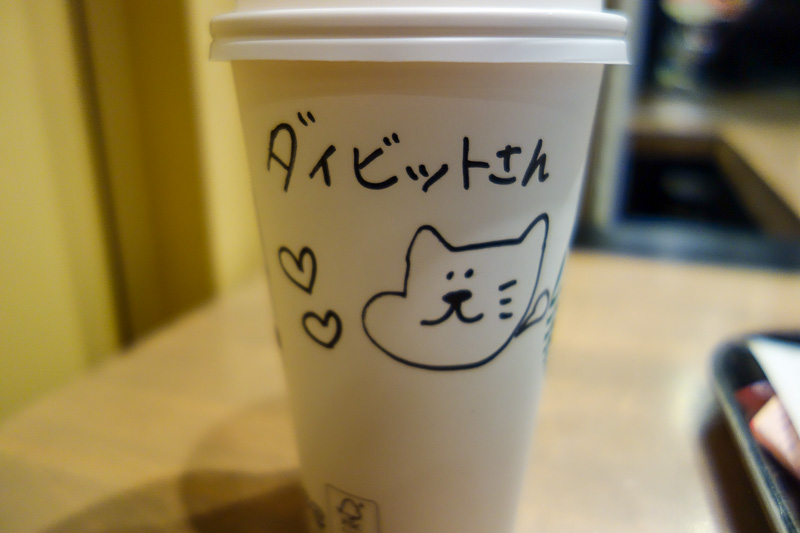 Japan-Osaka-Sapporo-Kansai-Chitose - My regular morning coffee at Starbucks was differnt today in Kyoto, I got a picture and a message. I have no idea what it says, but the cat she drew s