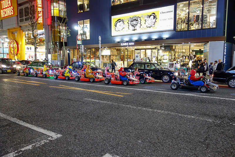 Japan-Shibuya-Guitar-Food-Curry - I had read about this. I cannot believe they allow people to do this. Tourists dress up in onesies and drive around the busiest streets in Tokyo in go