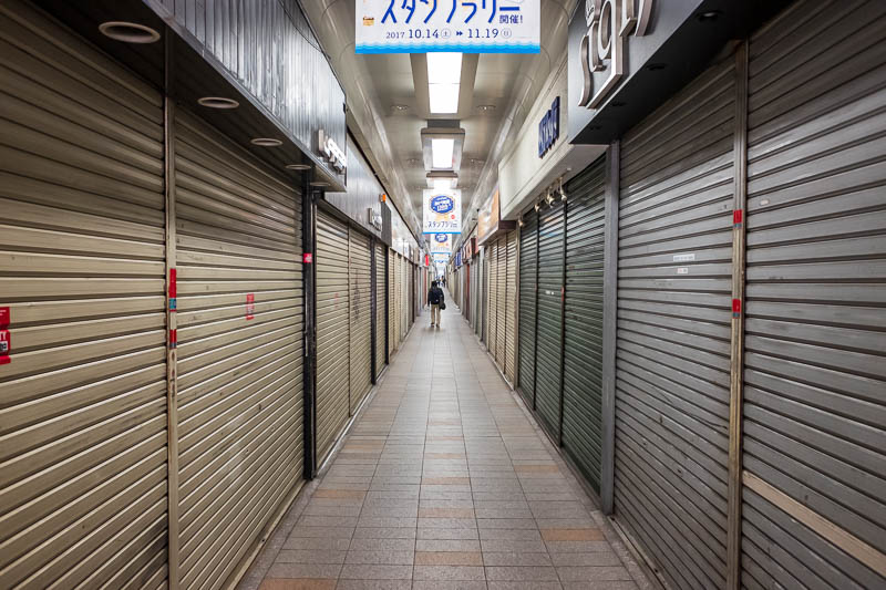 Japan-Kobe-Gifu-China Town-Shinkansen - The last bit of my walk, between the tracks, miles and miles of closed garage doors. I dont know how many of them still have shops behind them or if t