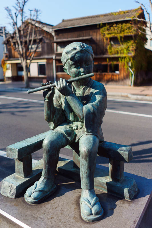 Japan-Karatsu-Castle-Hiking - The main street has lots of statues of boys playing flutes. I dont know what to think about this.
