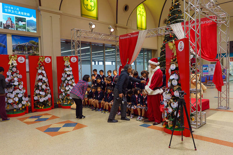 Japan-Nagasaki-Tokyo-Airport - I was not planning to take this photo but I have a story. Before these kids assembled for this photo they did a very loud countdown for Santa to appea