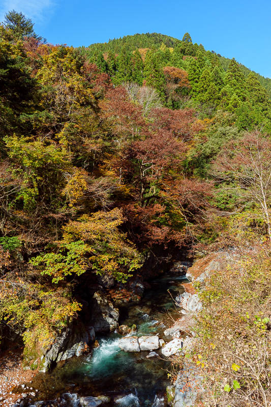 Japan-Tokyo-Hiking-Mount Kawanori - The road followed this river with the blue water running over rocks.