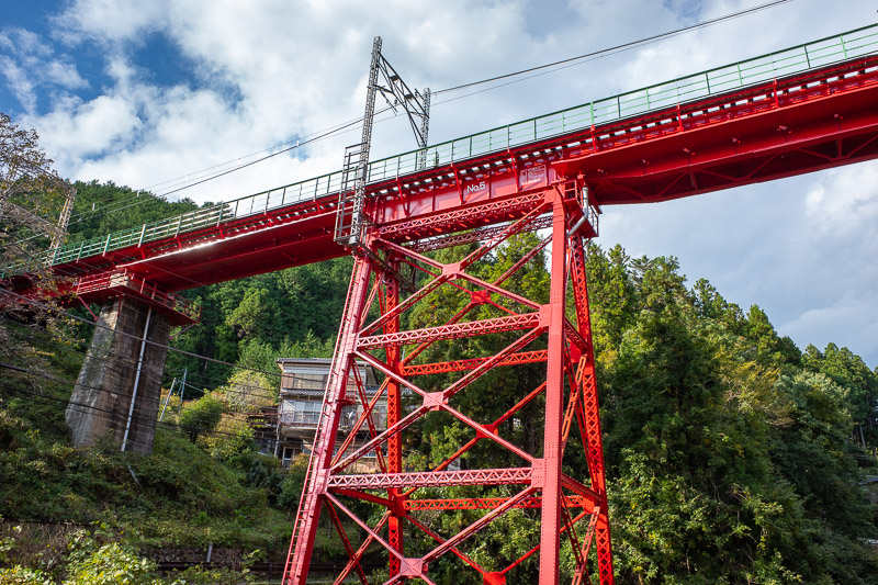 Japan for the 9th time - Oct and Nov 2019 - However, I had to appreciate the bright red train bridge. This photo doesnt really convey that I am standing on a bridge to take the photo, and the tr
