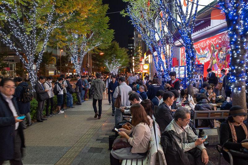 Japan for the 9th time - Oct and Nov 2019 - Here in Akihabara there are people in huge groups on their phones. All of them are hopeless addicts playing Pokemon Go. The game makes you go to speci