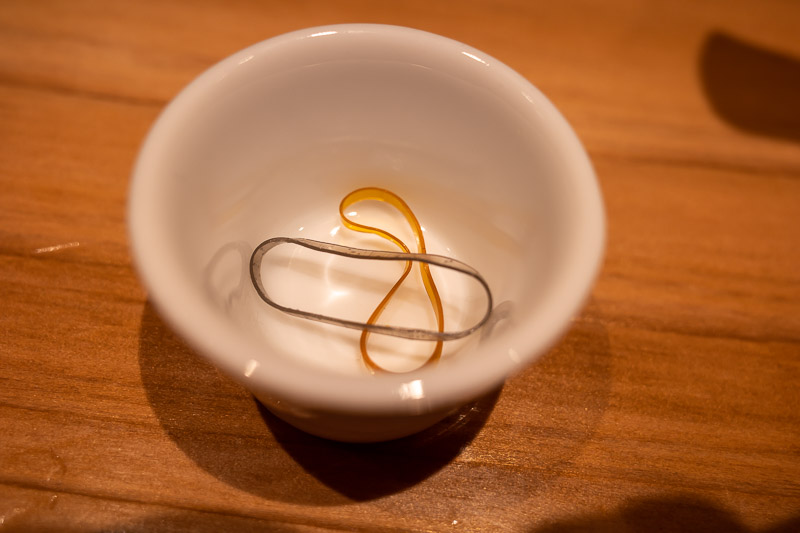 Japan for the 9th time - Oct and Nov 2019 - Strange last photo of the night. Here in Sichuan fusion ramen shop, they have kindly provided hair ties so that you dont dissolve your hair in the spi