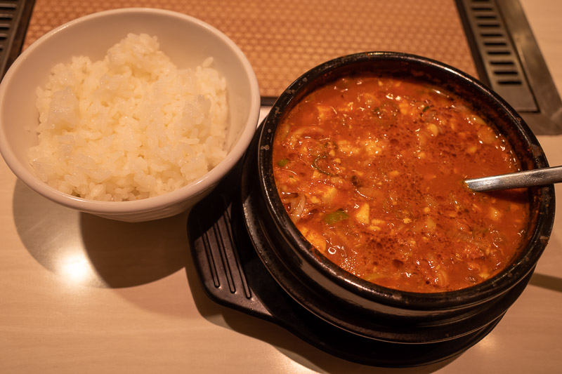 Japan-Takasaki-Food - I elected on the spicy raw horse and tofu stew. Negotiating what size rice I wanted had the waitress giggling uncontrollably for no apparent reason. S