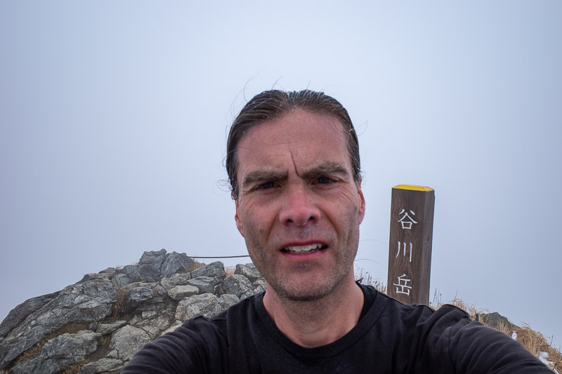 Japan-Hiking-Mount Tanigawa-Doai Station - Here I am on the summit. It was very windy on the summit, and very cold. I was ahead of schedule, but no time for happy snaps. I could not do THE STAN