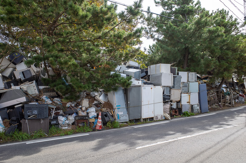 Japan for the 9th time - Oct and Nov 2019 - On the other side of the lagoon, I passed this hoarders house. The photo does not capture the scale of the rubbish, it gets higher and higher the furt