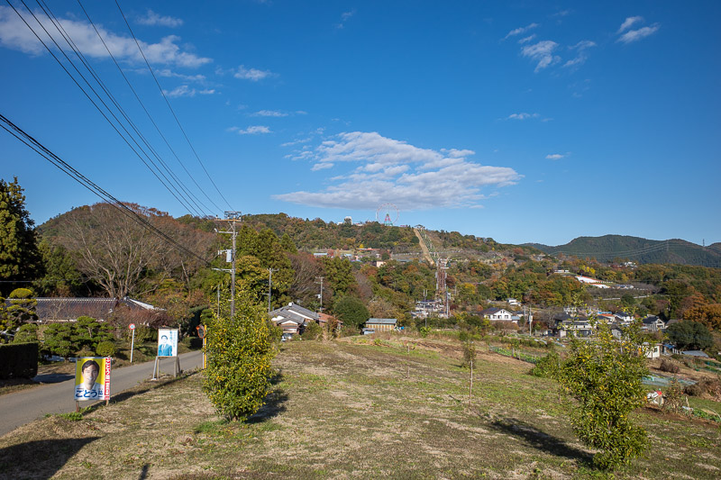 Japan for the 9th time - Oct and Nov 2019 - Eventually I got back beyond the damaged area. All day I could hear terrible music. Look across the valley and up the hill and you will see a theme pa