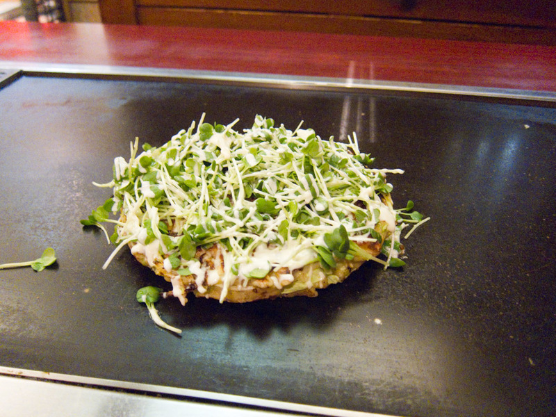 Japan-Osaka-Ferris Wheel-Okonomiyaki - My dinner, Osakas signature dish, Okonomiyaki. Its a kind of cabbage pancake with different stuff in and on it. The most common kind has sweet barbecu