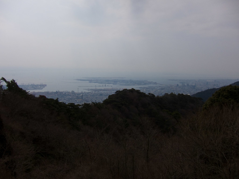 Japan-Hiking-Kobe-Curry-Mount Rokko - The view from top allows you to take in not only Kobe as seen here but Osaka on the other side. The bright sunshine of the morning was replaced by haz