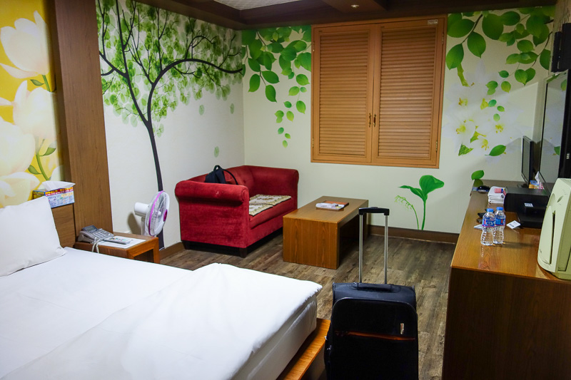 Korea again - Incheon - Daegu - Busan - Gwangju - Seoul - 2015 - Hotel photo number 1. Note the awesome wallpaper. The bed is a board with a thin layer of granite on it for padding. Those windows open to a wall. As 