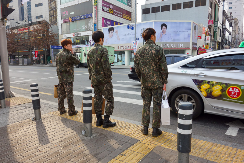 Korea-Daegu-Hiking-Apsan - Heres 3 Korean soldiers off to report for duty, carrying their beauty products.