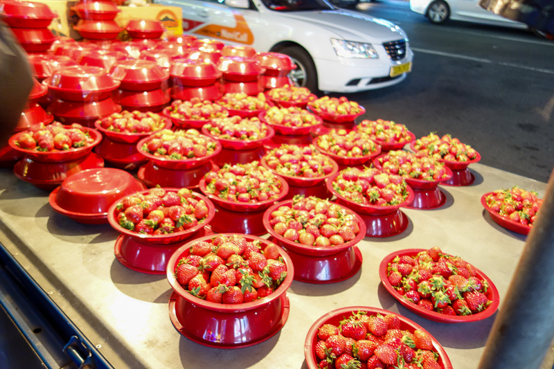 Korea-Busan-Neon-Beef-Department Store - Red strawberries in red buckets under brilliant white light broke my cameras super intelligent auto night setting. Note I never ever ever ever use fla