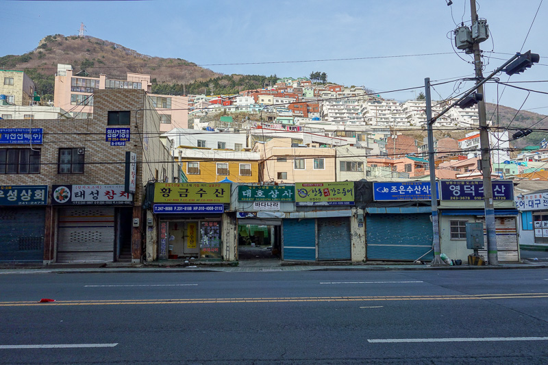 Korea again - Incheon - Daegu - Busan - Gwangju - Seoul - 2015 - I dont know if this is poor people housing, rich people housing, or holiday homes. They are however destined to one day slip into the ocean in a lands