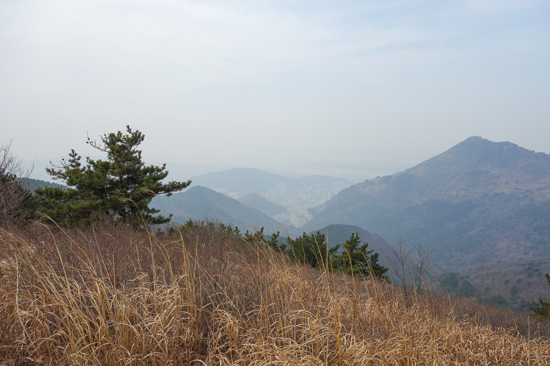 Korea-Busan-Hiking-Gudeoksan - Now I am somewhere along the ridge, looking back at the peak where the selfie was taken.
