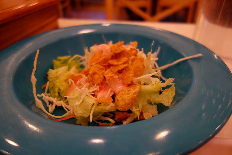 Korea-Gwangju-Hotel-Neon - My dinner was interesting tonight. This is one of the side dishes. Its lettuce, with a strange pink sauce, and corn flakes.