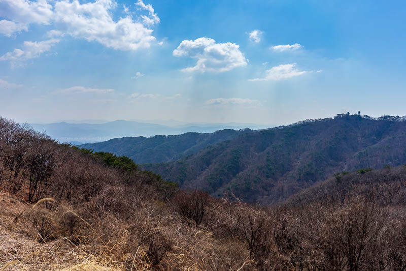 Korea-Seoul-Hiking-Cheonggyesan - This is a clearing by the gate of a mountain top military base. I would continue along those ridges.