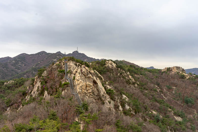 Korea-Seoul-Hiking-Gwanaksan - Once up on a peak I realised there were more peaks to cross before getting to the main peak. As you can see sometimes theres a stair case up the peak 